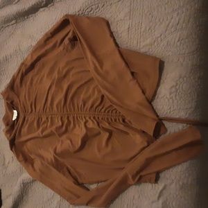 See through brown blouse
